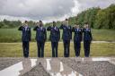 Serving USAAF personnel salute the Lavenham Airfield memorial plaque