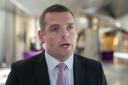 Scottish Conservative leader Douglas Ross spoke out about the ‘unacceptable’ abuse he and his family face (Jane Barlow/PA)