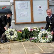 Ellen Murphy, the Mayor of Sudbury (right) and Derek Davis, vice chair of Babergh District Council, laying wreaths in memory of Her Majesty The Queen