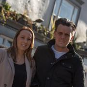 White Horse landlord Gary Addison, pictured with his partner Ashley, is concerned about drunk teenagers climbing on top of a white horse statue on the first floor ledge of his pub. Picture: SARAH LUCY BROWN