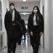 Pupils in England no longer have to wear masks in communal places from today