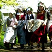 Children set off to work around the farm at a Kentwell Hall Tudor weekend event in 2003
