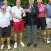 Aldeburgh's Hambro Cup winning team - from left: Logan Mair, Tim Hedin, Jim Harrison, Jack Levermore, team captain Robert Palmer receiving the Hambro Cup from SGU president Colin Firmin, Andy Edmond, James Ollington and Jack Strowger. Picture: TONY