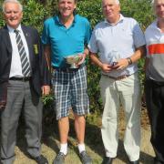 Suffolk senior champion Andy Ball (second from left) with runner-up Roger Taylor and third place John Whitby who were both one shot off the pace. Suffolk Golf Union president Colin Firmin is on the left. Photograph: TONY GARNETT