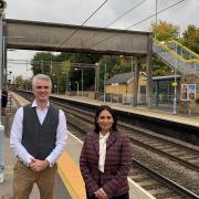 James Cartlidge and Priti Patel at Marks Tey station with the existing footbridge that has no lifts.